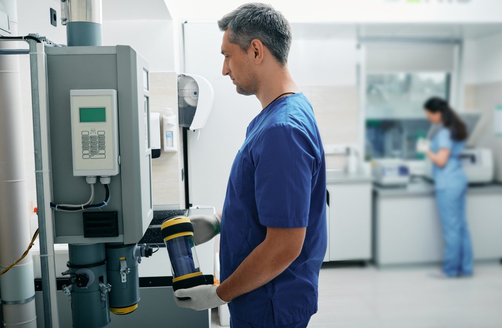 Laboratory assistant sends results of patient's lab tests to attending physician using pneumatic mail