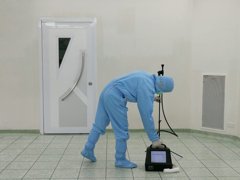 Inspector are testing dust inside the operating room with Particle Counter.